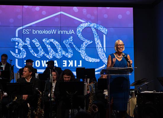 在线博彩's Vice President for University Advancement Dr. Meredith Brunen addresses a crowd onstage 